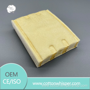 Yellow non-woven quilted square cotton pad